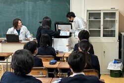 Students learning the history of the copying machine in class